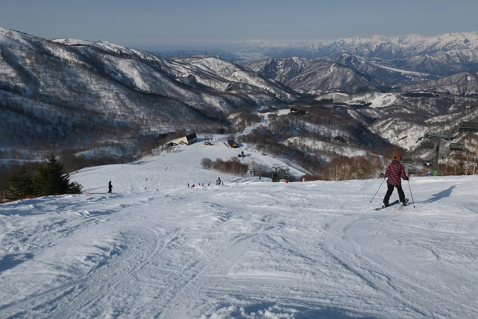 Skier on a groomed run at Kagura ski area in winter