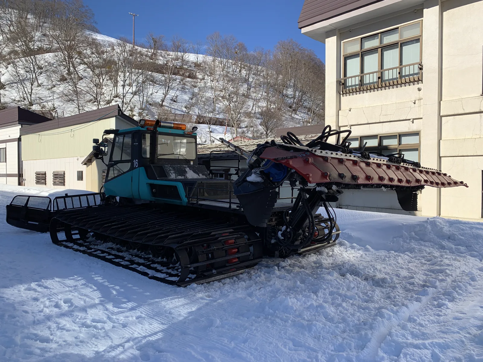 Deep winter snow and grooming machine at Seki Onsen Ski Resort